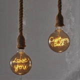 G125 Tea-Colored Custom Letter LED Globe Bulb with Hanging Single-Line Filament (4) G125 Tea-Colored Custom Letter LED Globe Bulb with Hanging Single-Line Filament (4)