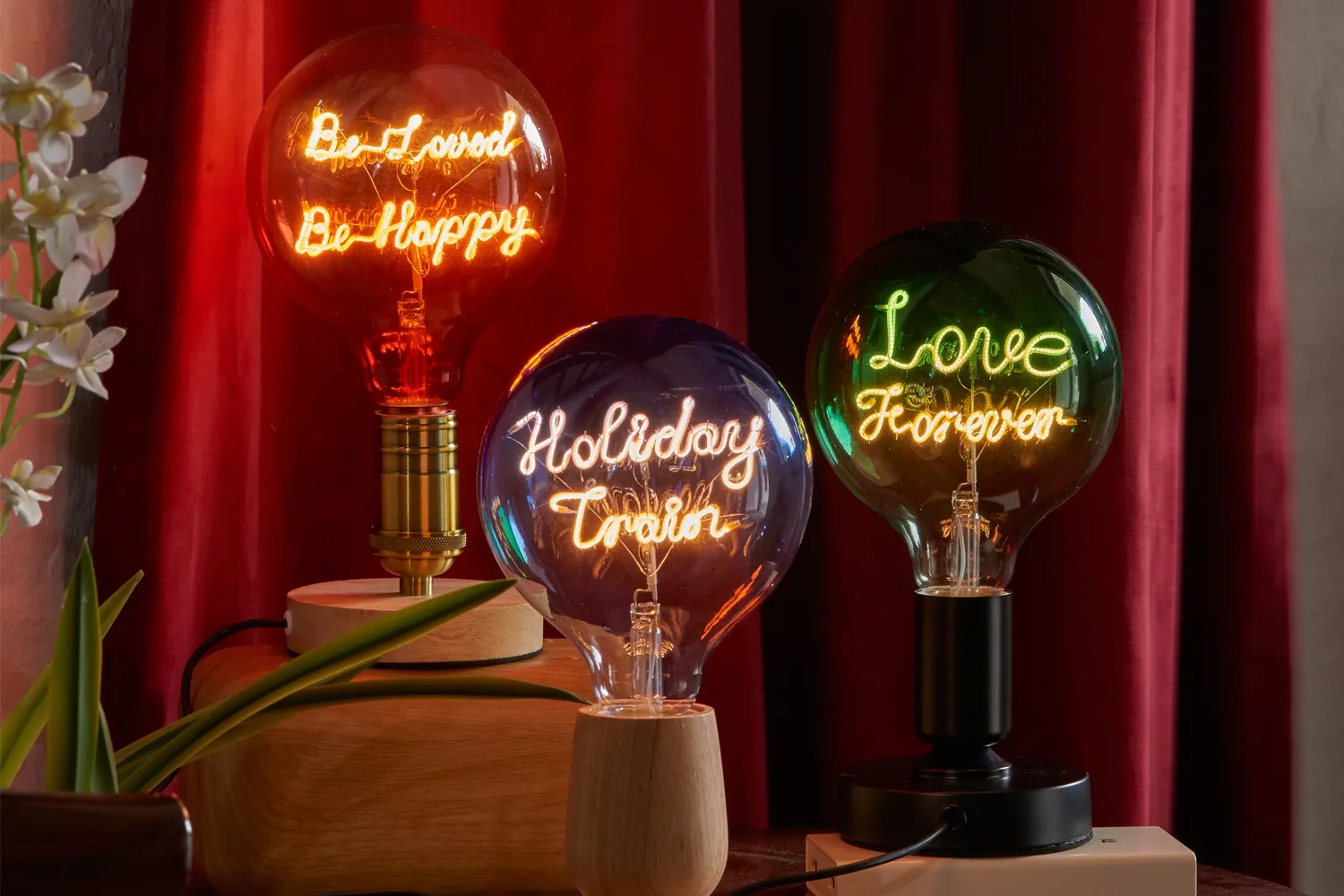 GLORILUM custom colored glass bulbs with illuminated words and letter patterns